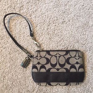Black and silver Coach wristlet